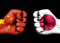 conflict between china and japan, male fists governments conflict concept