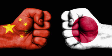 conflict between china and japan, male fists governments conflict concept